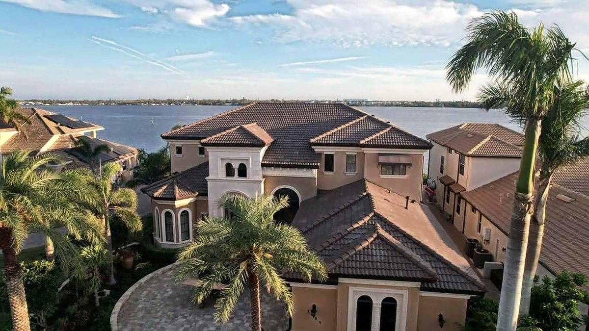 Tile roof on a two-story home, installed by Providential Roofing