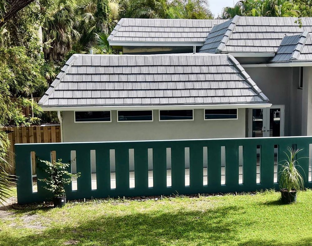 Gray concrete tile roof on a single-story home, installed by Providential Roofing