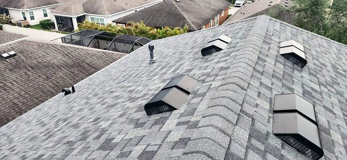 Gray shingle roof with new roof vents by Providential Roofing