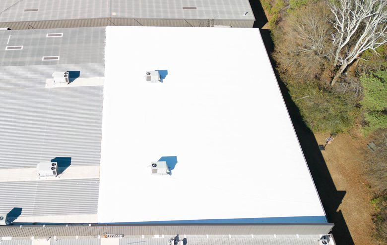 White TPO membrane roof on a commercial building
